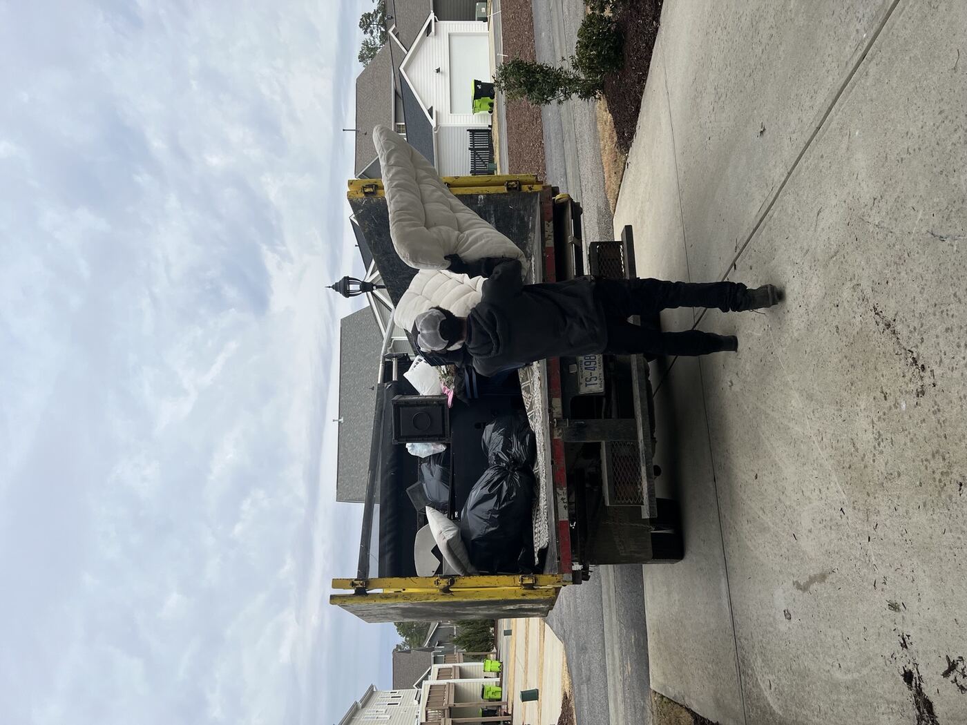 Deck debris being removed by Junk Doctors crew