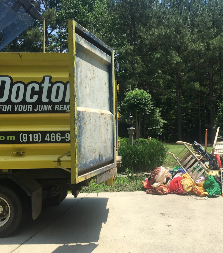 Junk Doctors truck ready to remove overlfow trash from a residence in raleigh