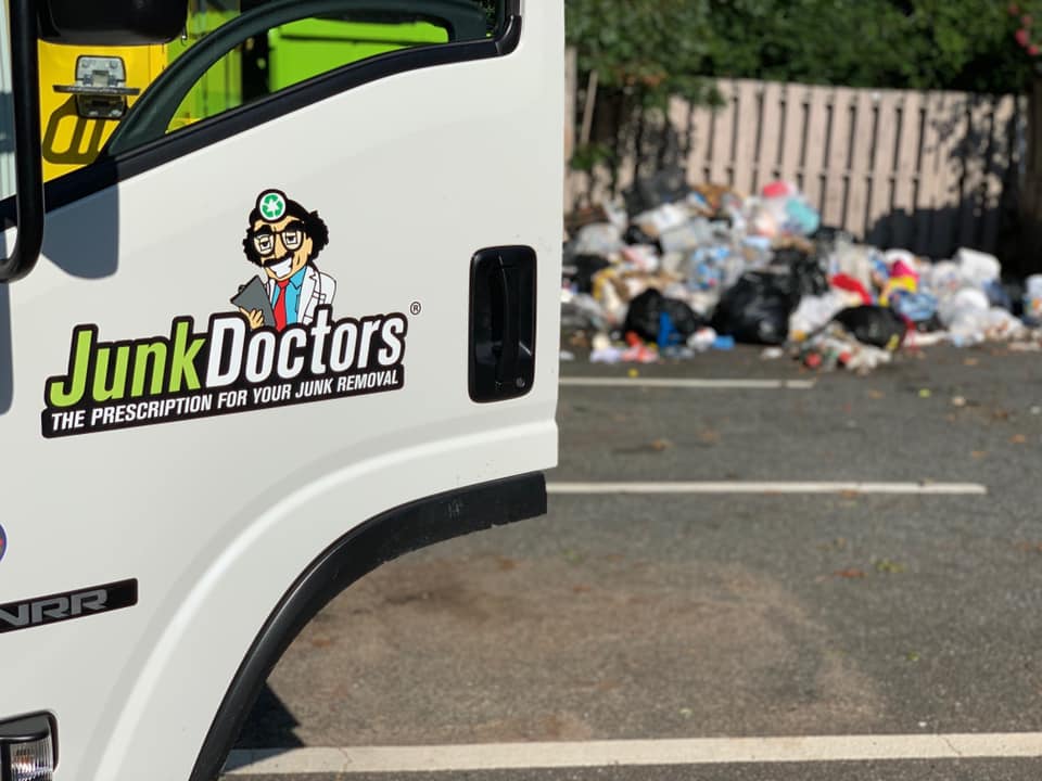 Bagged trash on the curb during hoarding cleanout services in North Carolina